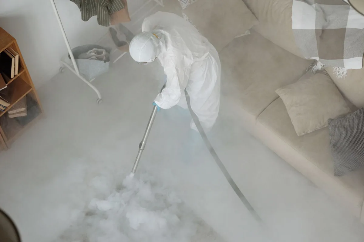 Biohazard cleanup technician in protective equipment, Aspen, CO